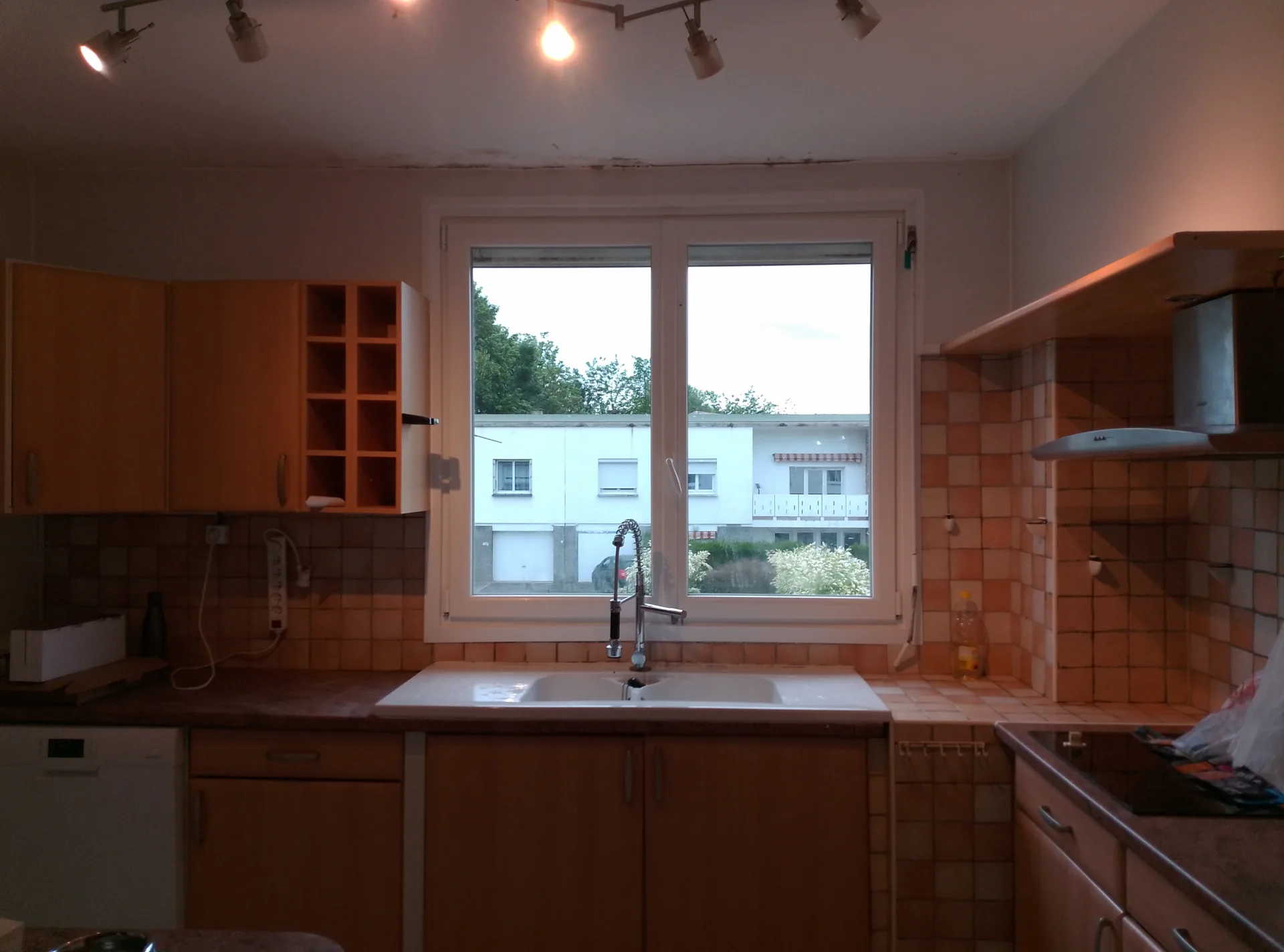 Before the work: the old kitchen with its original wall tiles