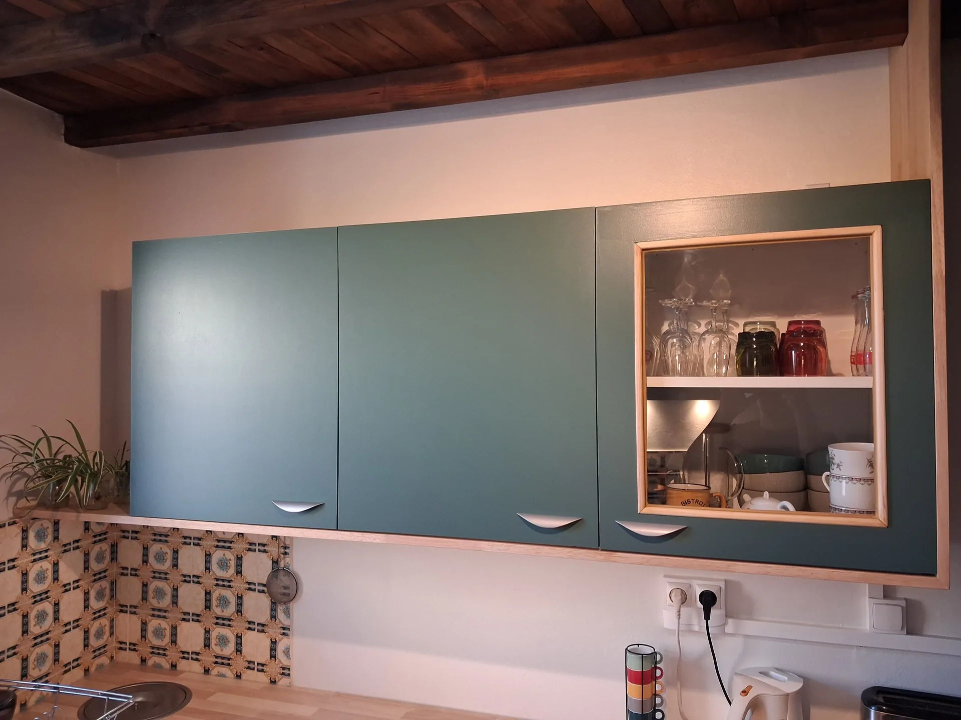 Bespoke wall units with a glazed door and LED strip