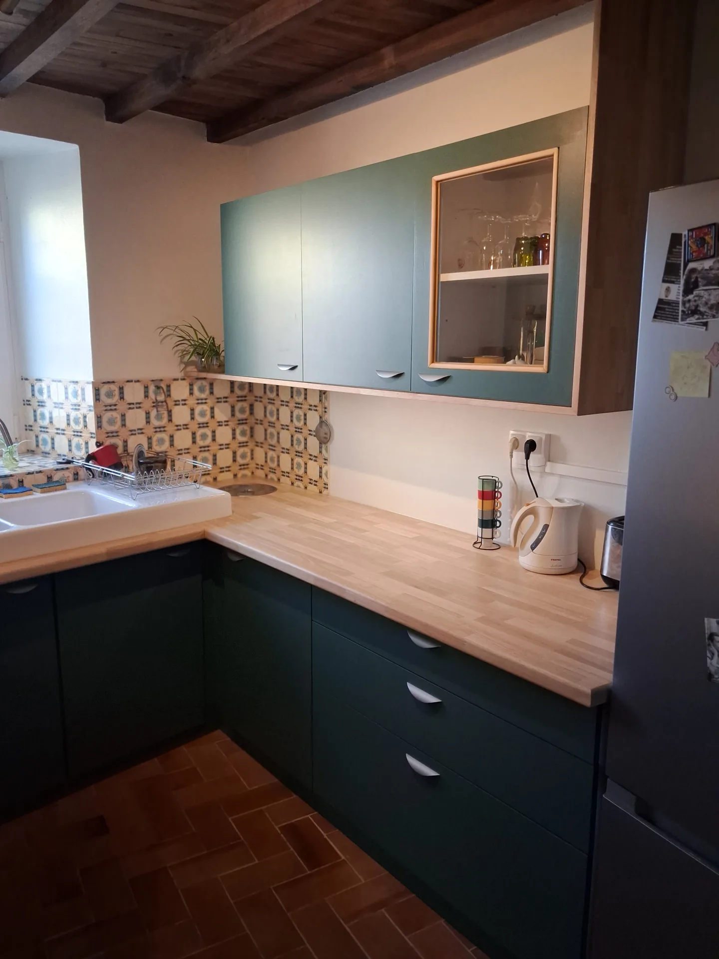 Wall unit with a glazed door and LED strip above the worktop