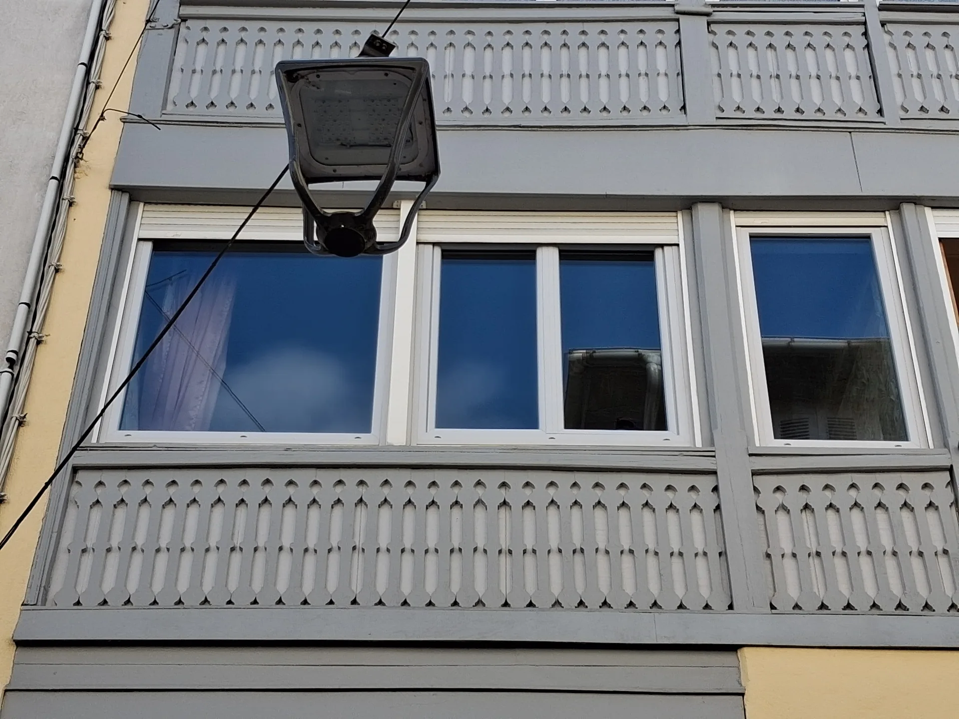 Timber-clad facade with new uPVC windows in Bagnères-de-Bigorre