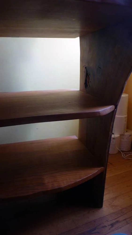 Close-up of the burr walnut grain and the cherry shelves