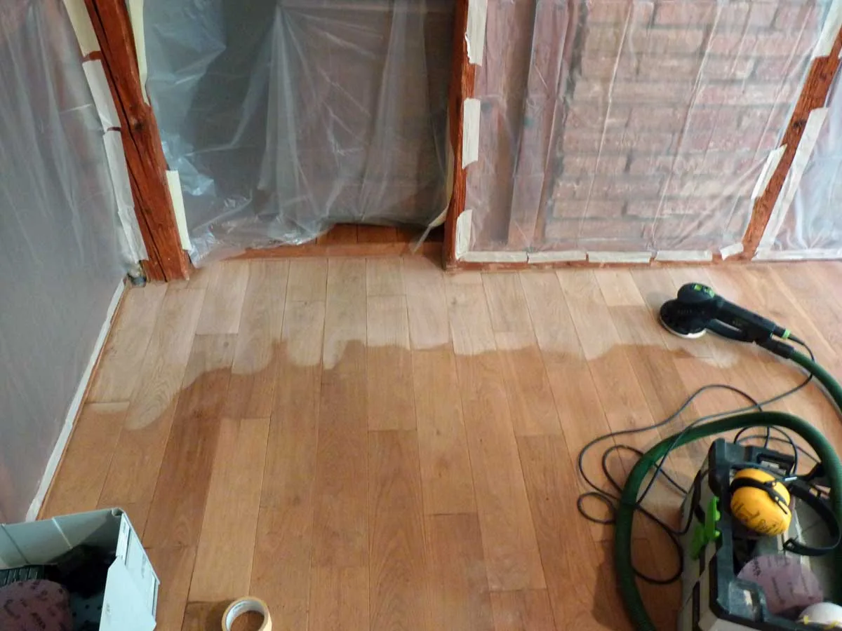 Restored and lacquer-sealed wood floor in the living room
