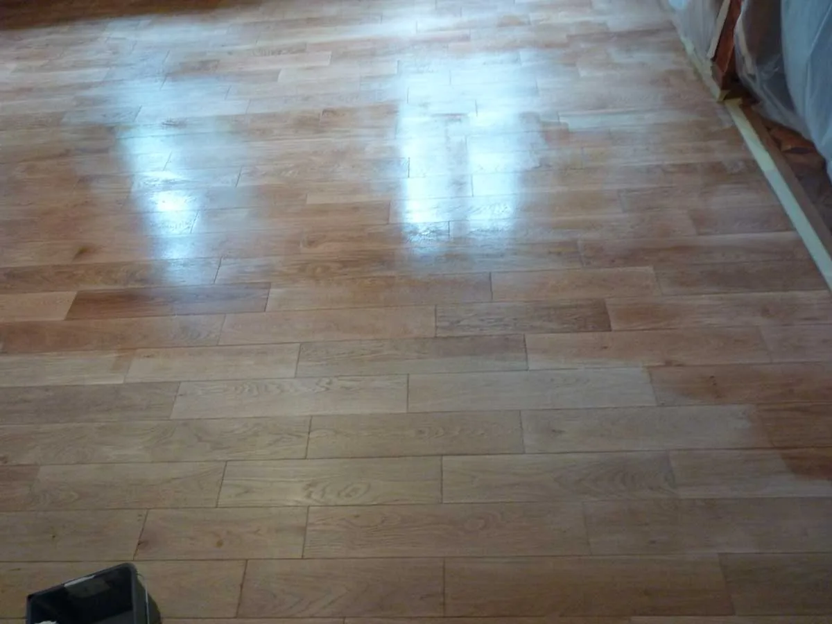 Sanding of the solid wood floor in progress
