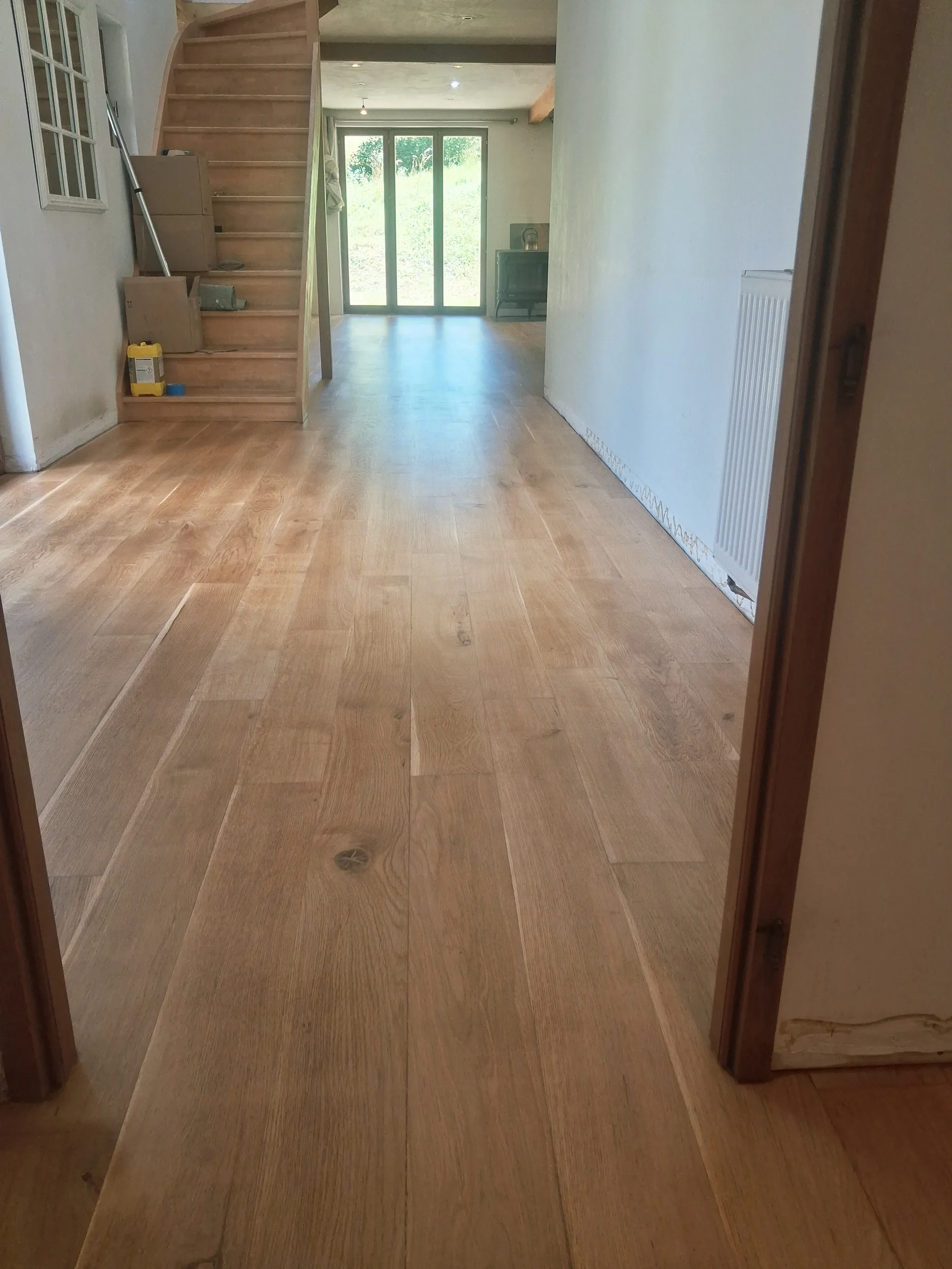 The hallway in restored oak flooring, matt finish