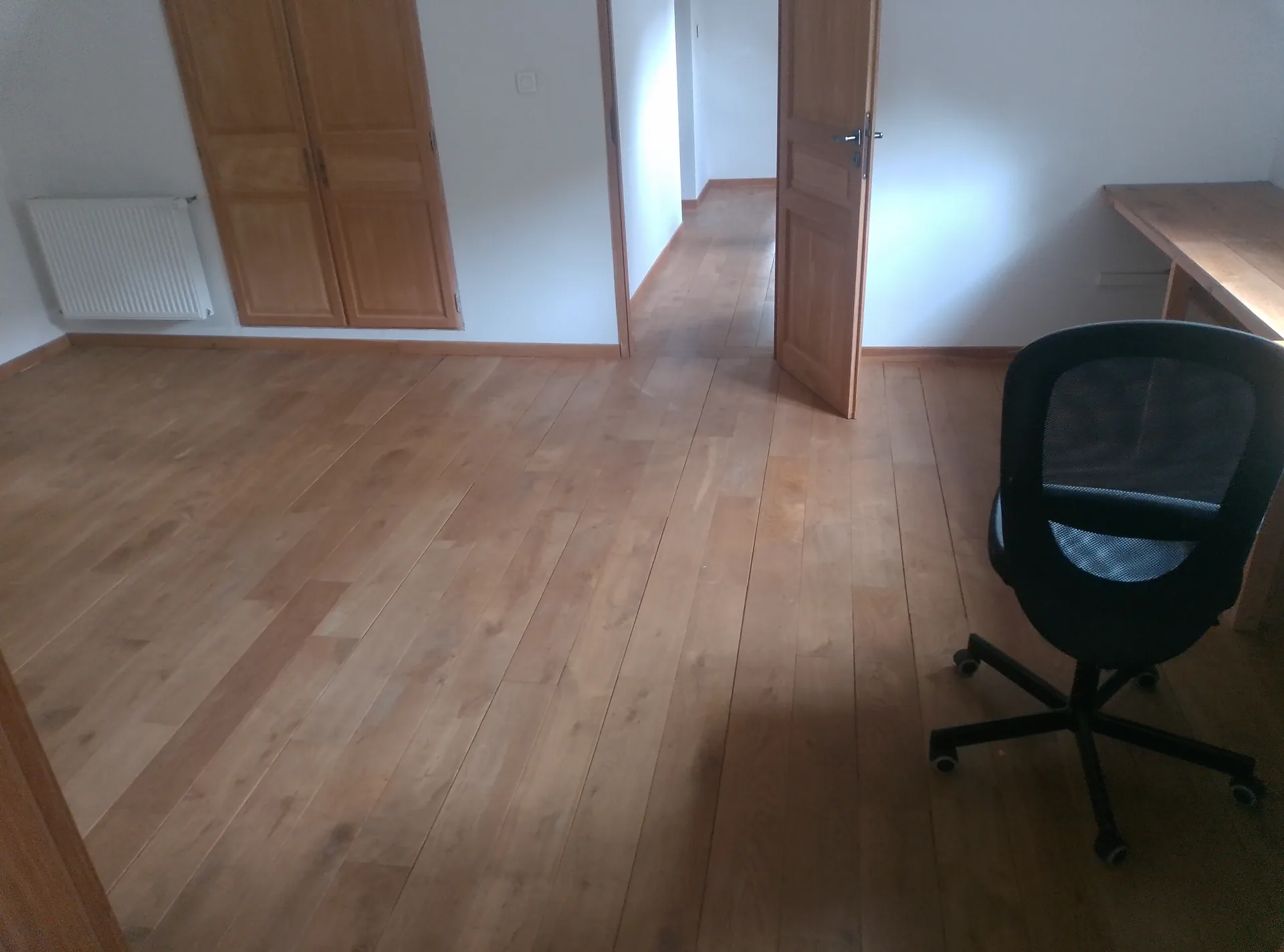 The upstairs oak floor before the work, with its old, dulled finish