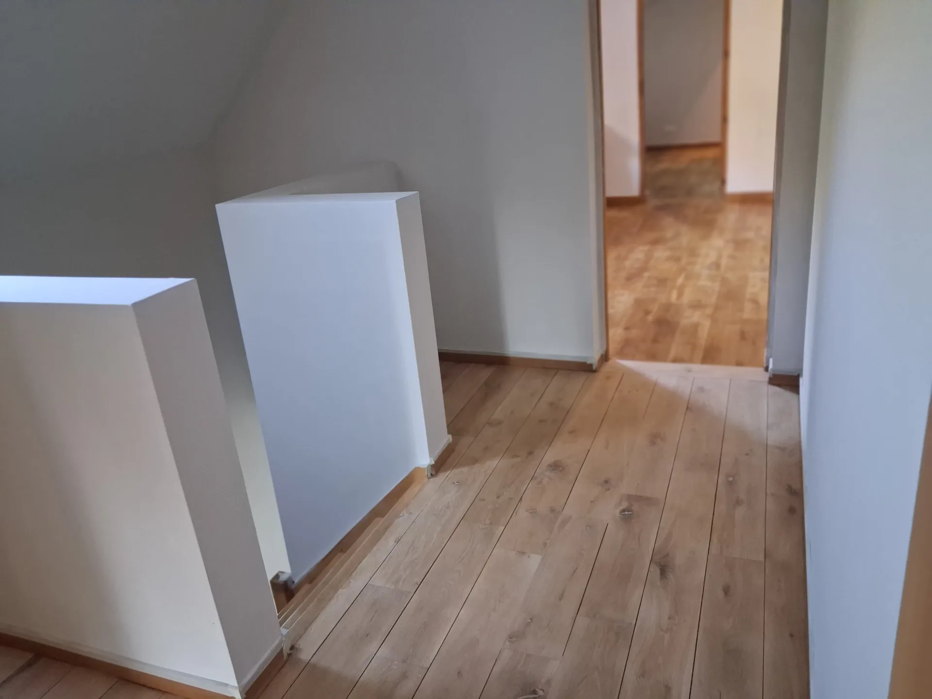 Landing and hallway upstairs, with the restored oak floor