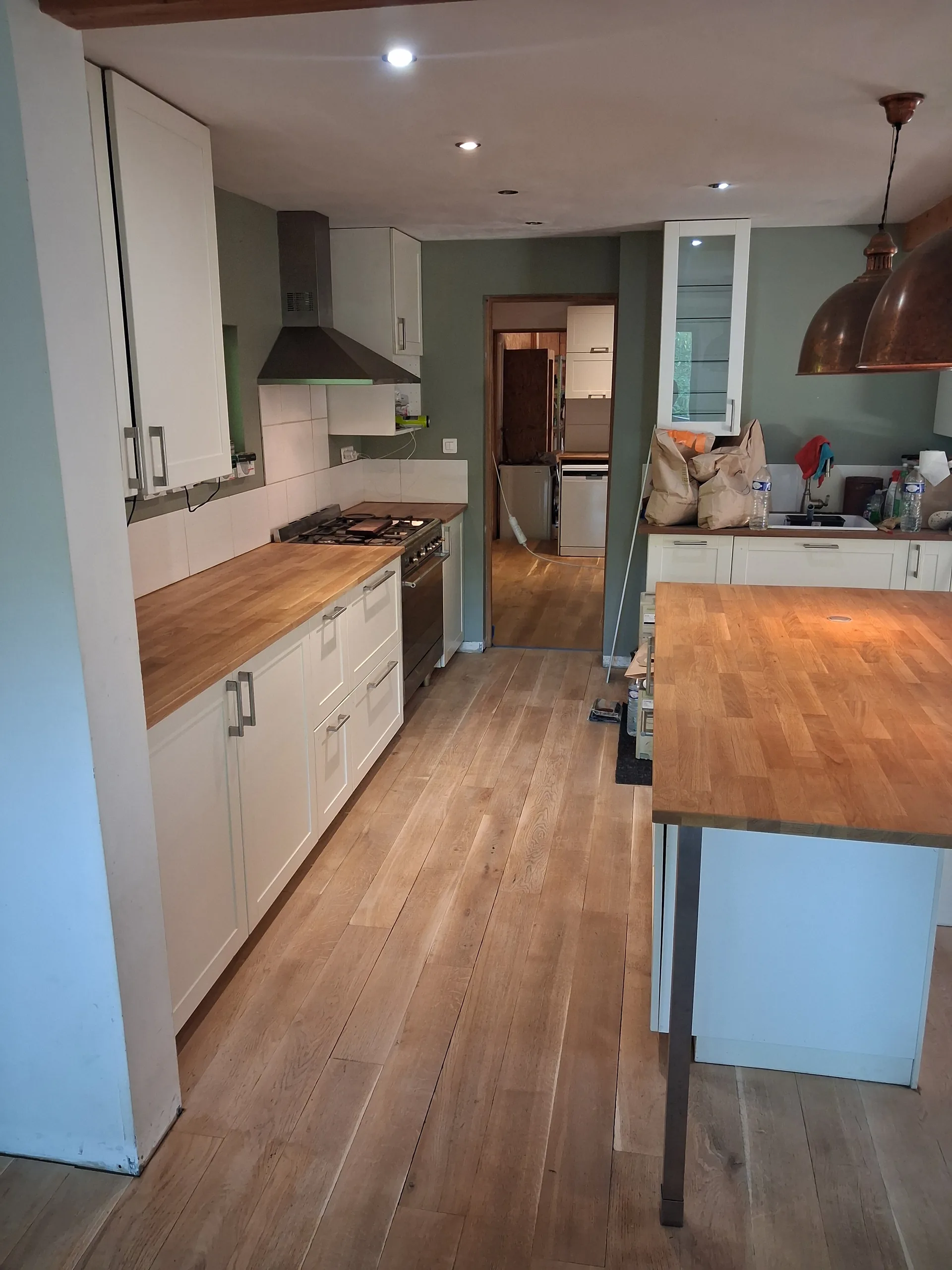 The long run of worktop re-varnished, kitchen reassembled