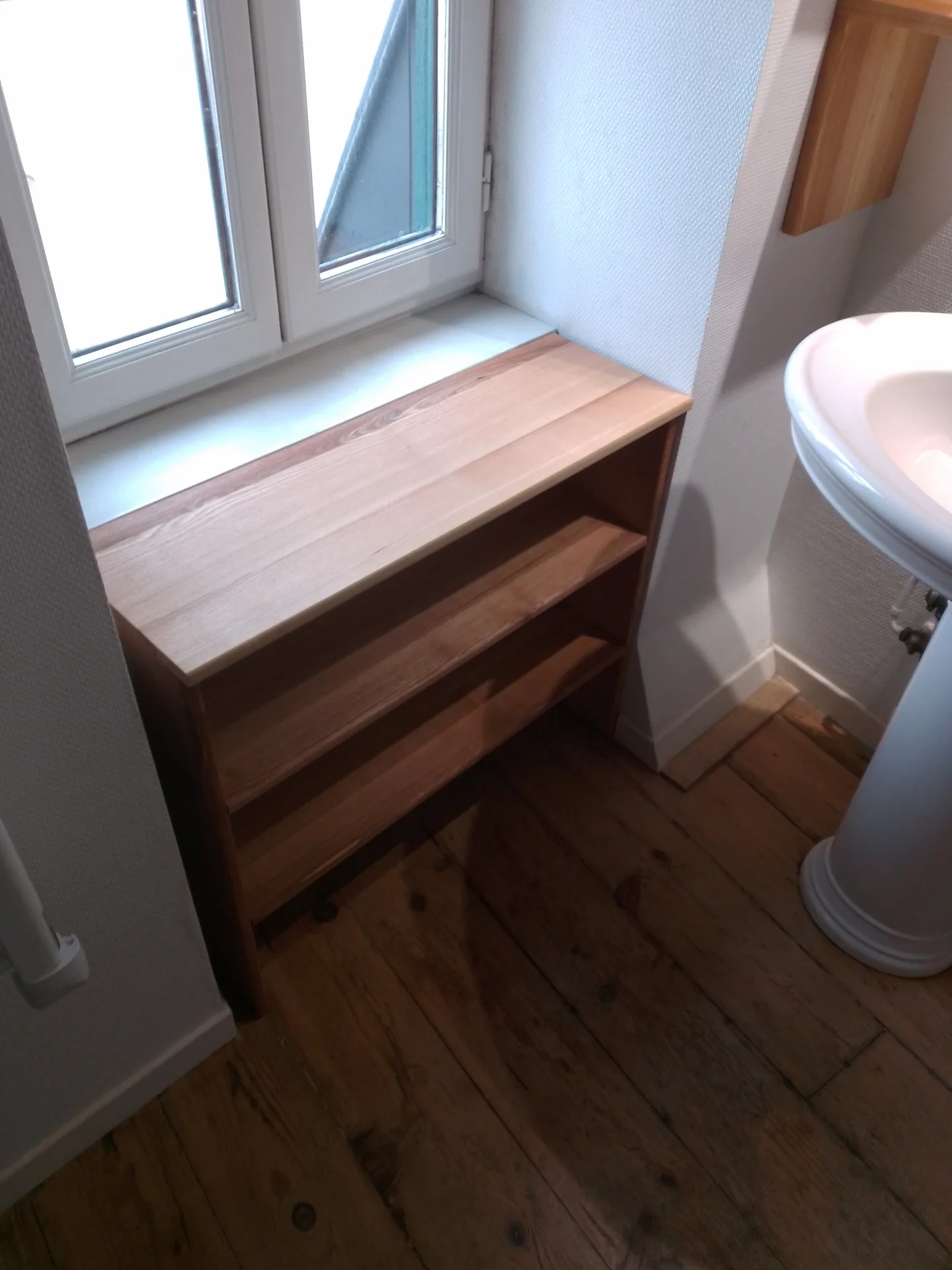 The alcove unit and the pedestal basin, on the old wood floor